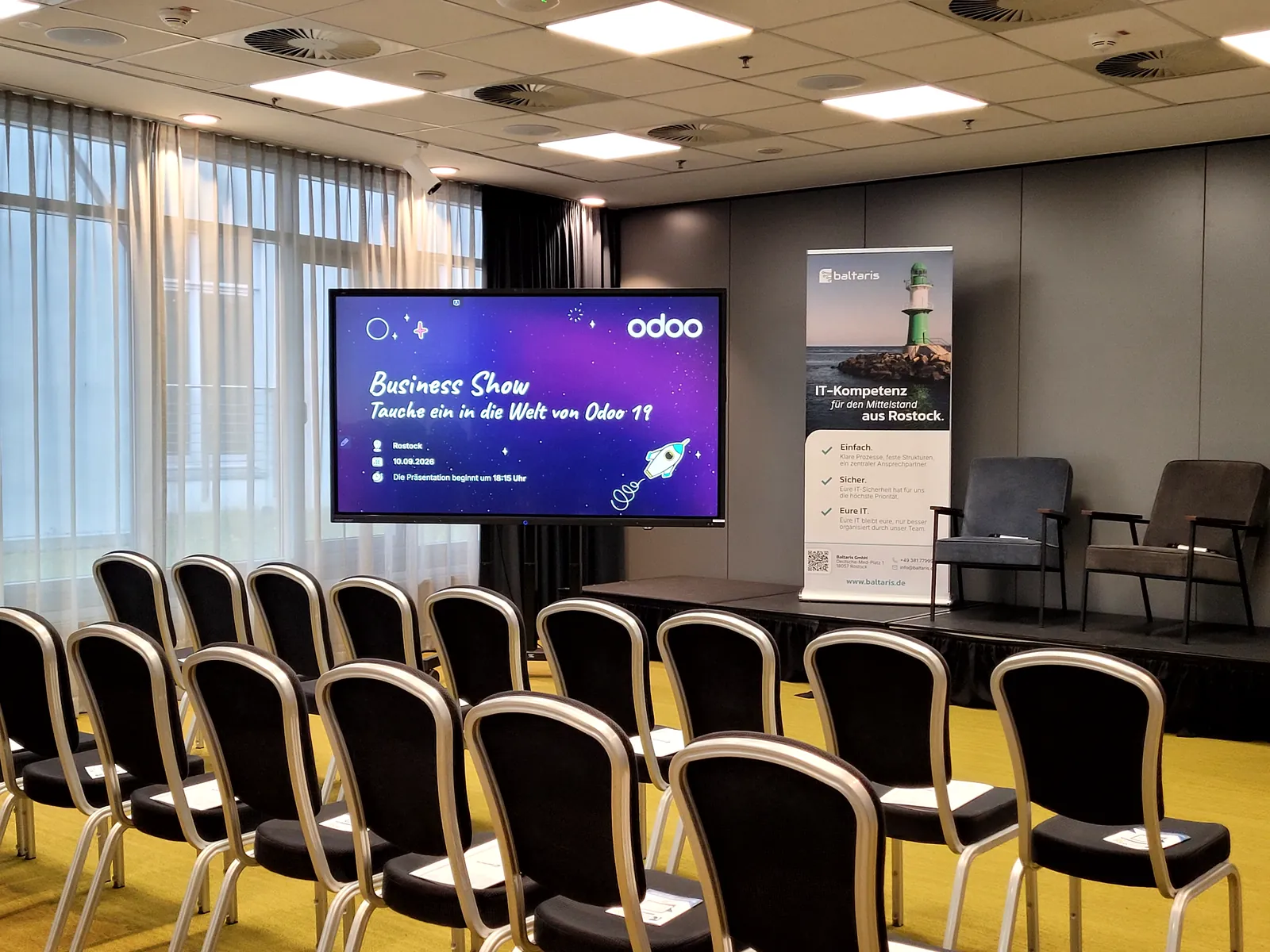 Bühne der Odoo Business Show Rostock 2026 mit Baltaris-Roll-up